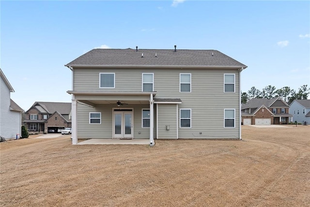 rear view of property with ceiling fan, french doors, and a patio area