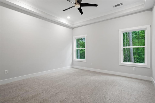 3902 Bouldercrest Rd SE, Ellenwood, GA 30294 - empty room with ceiling fan, a raised ceiling, baseboards, and plenty of natural light