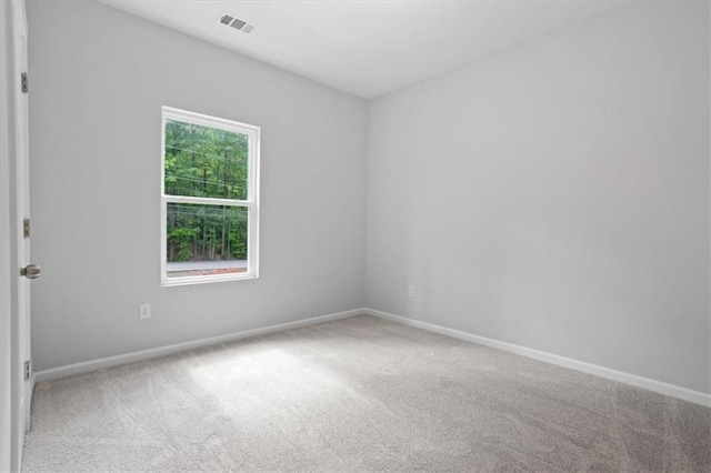 3902 Bouldercrest Rd SE, Ellenwood, GA 30294 - spare room featuring carpet flooring, baseboards, and visible vents
