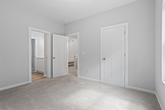 3902 Bouldercrest Rd SE, Ellenwood, GA 30294 - unfurnished bedroom featuring baseboards, carpet flooring, and ensuite bath