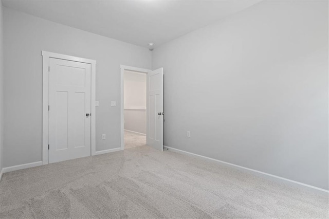 3902 Bouldercrest Rd SE, Ellenwood, GA 30294 - unfurnished bedroom featuring carpet floors and baseboards