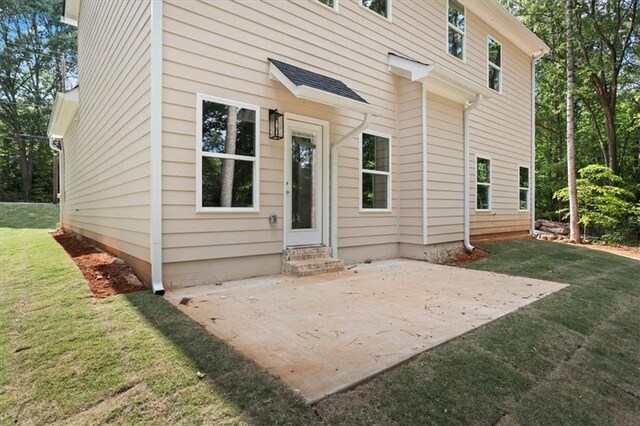 3902 Bouldercrest Rd SE, Ellenwood, GA 30294 - back of house with a yard, a patio, and entry steps
