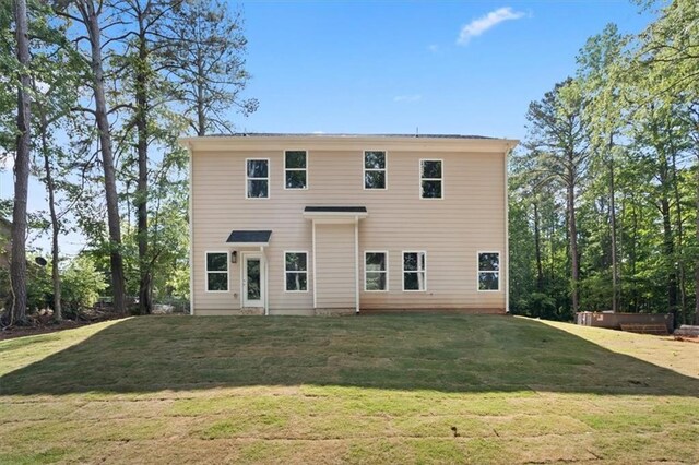 3902 Bouldercrest Rd SE, Ellenwood, GA 30294 - back of house featuring a lawn