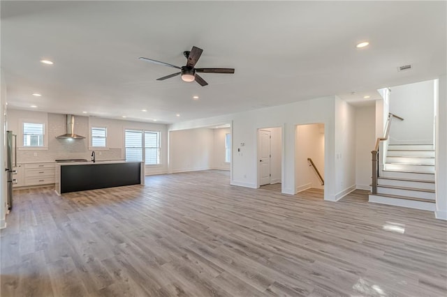 668 Liella Park SE, Atlanta, GA 30312 - unfurnished living room featuring light hardwood / wood-style floors and ceiling fan