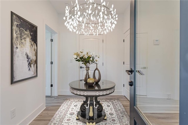 foyer entrance with french doors and hardwood / wood-style flooring