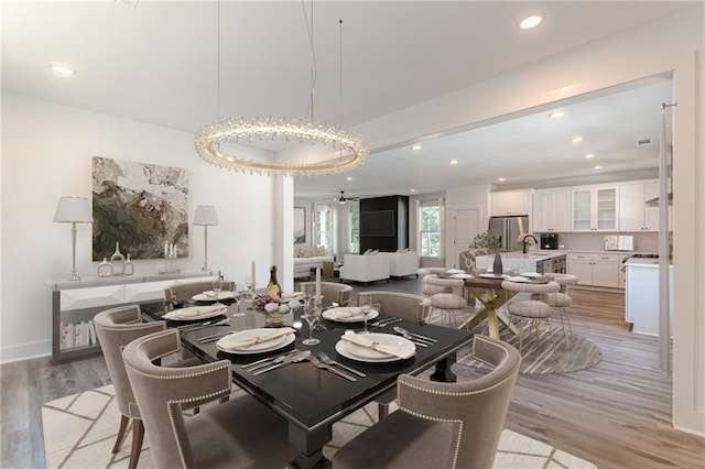 668 Liella Park SE, Atlanta, GA 30312 - dining space with sink, light wood-type flooring, and ceiling fan