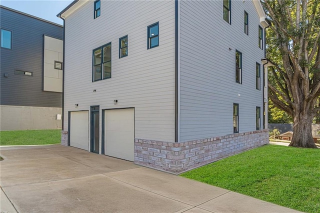 668 Liella Park SE, Atlanta, GA 30312 - view of home's exterior with a yard and a garage