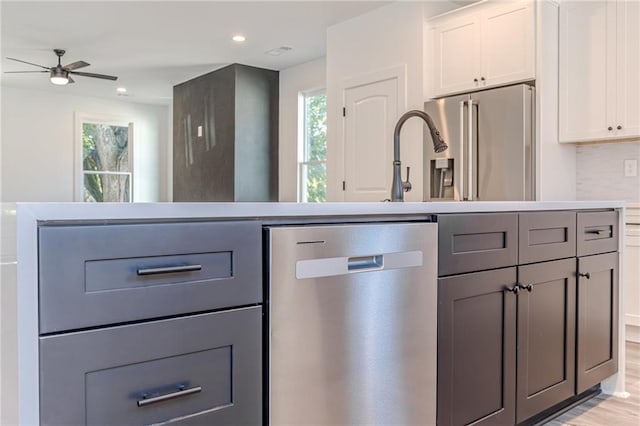 668 Liella Park SE, Atlanta, GA 30312 - kitchen with a wealth of natural light, white cabinets, stainless steel appliances, and gray cabinets
