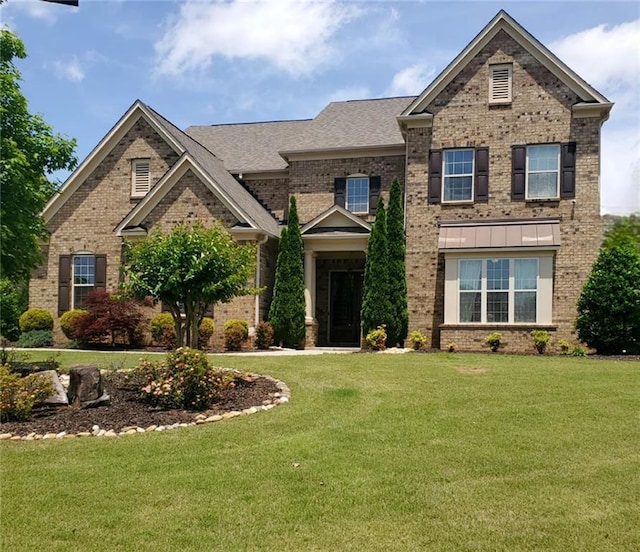 6110 Read Rd, Suwanee, GA 30024 - view of front of home featuring brick siding and a front lawn