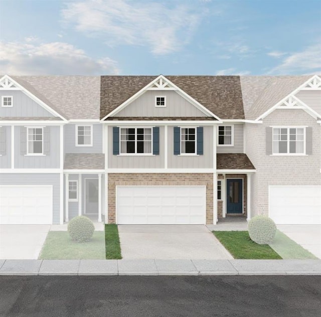350 Lanier Cir, Woodstock, GA 30189 - view of property featuring driveway, an attached garage, board and batten siding, and a shingled roof
