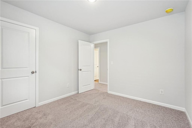350 Lanier Cir, Woodstock, GA 30189 - unfurnished bedroom with carpet floors and baseboards