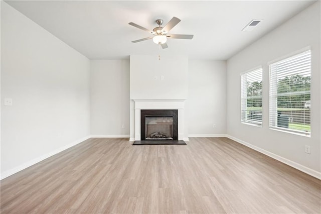 350 Lanier Cir, Woodstock, GA 30189 - unfurnished living room with ceiling fan, wood finished floors, and a fireplace with raised hearth