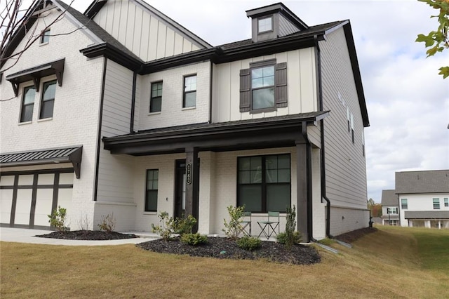 view of front of house with a front yard and a garage