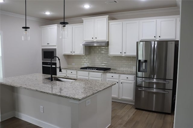 kitchen featuring stainless steel refrigerator with ice dispenser, sink, white cabinets, and decorative light fixtures