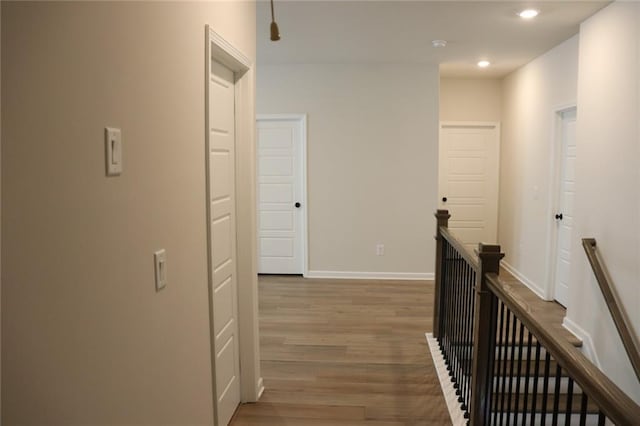 hall with wood-type flooring