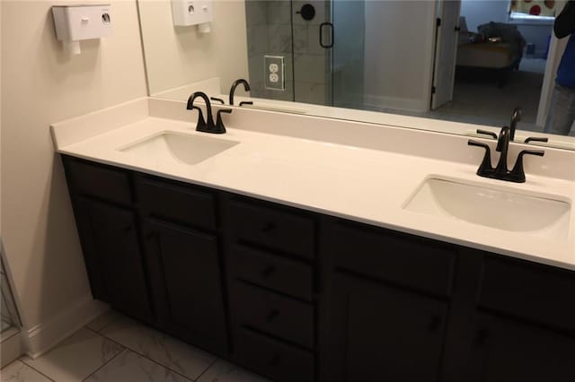 bathroom with an enclosed shower and vanity