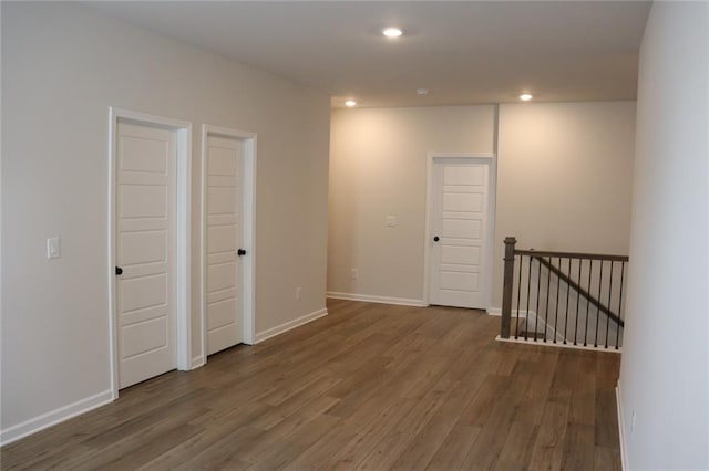 empty room with dark wood-type flooring