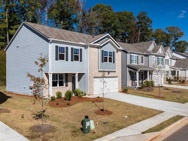 view of front of property featuring a garage and a front lawn