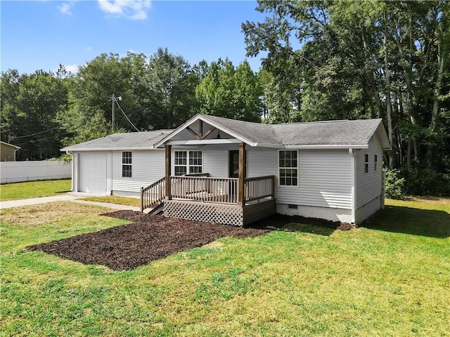 ranch-style home featuring a garage and a front lawn