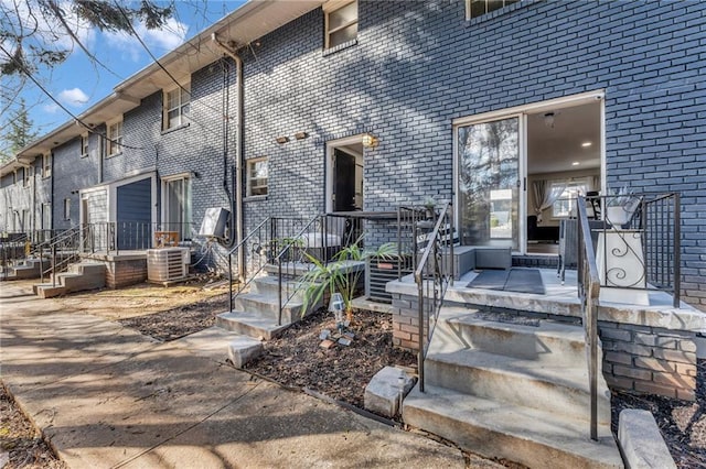 doorway to property featuring cooling unit