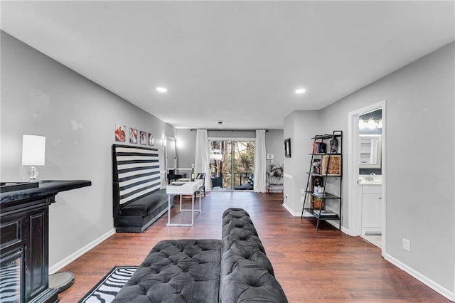 living room featuring dark wood-type flooring