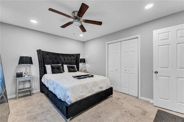 carpeted bedroom with a closet and ceiling fan