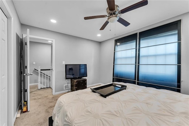 carpeted bedroom with ceiling fan