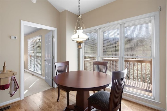 71 Yellow Root Dr, Big Canoe, GA 30143 - dining room featuring light wood finished floors, baseboards, and vaulted ceiling