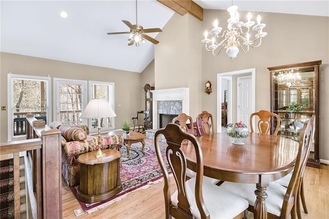 71 Yellow Root Dr, Big Canoe, GA 30143 - dining area featuring light wood-type flooring, high vaulted ceiling, a ceiling fan, beam ceiling, and a chandelier