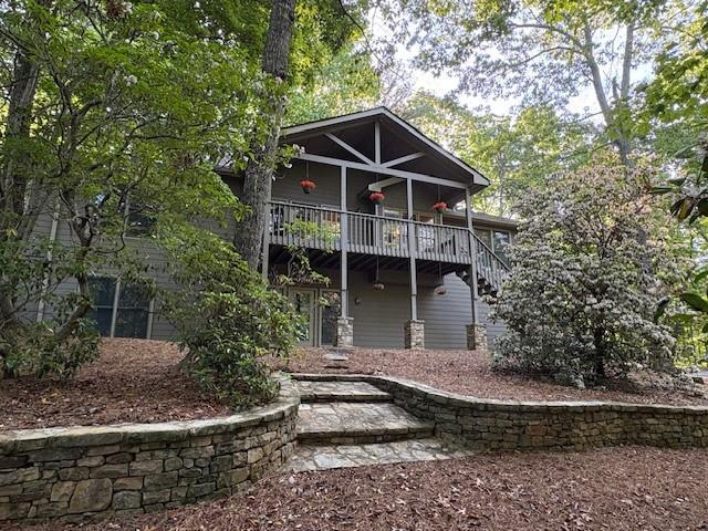 71 Yellow Root Dr, Big Canoe, GA 30143 - rear view of property with stairway and a wooden deck