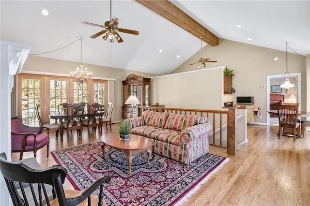 71 Yellow Root Dr, Big Canoe, GA 30143 - living area with ceiling fan, beamed ceiling, a chandelier, light wood-style floors, and high vaulted ceiling