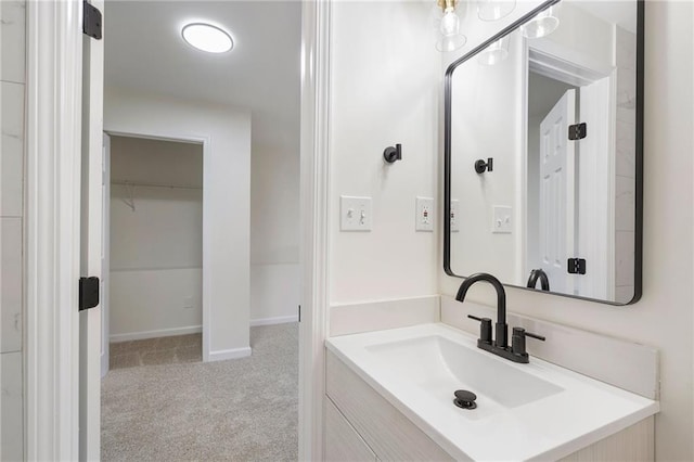 bathroom with vanity and baseboards