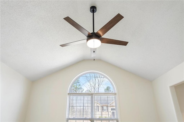 interior details with a ceiling fan and a textured ceiling