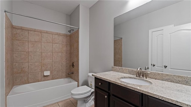 bathroom featuring toilet, shower / washtub combination, vanity, and tile patterned flooring