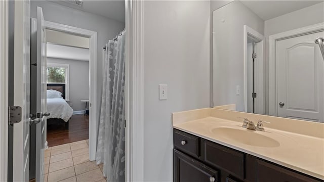 full bathroom with tile patterned flooring and vanity