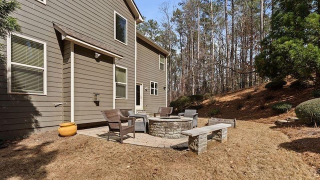 exterior space featuring an outdoor fire pit