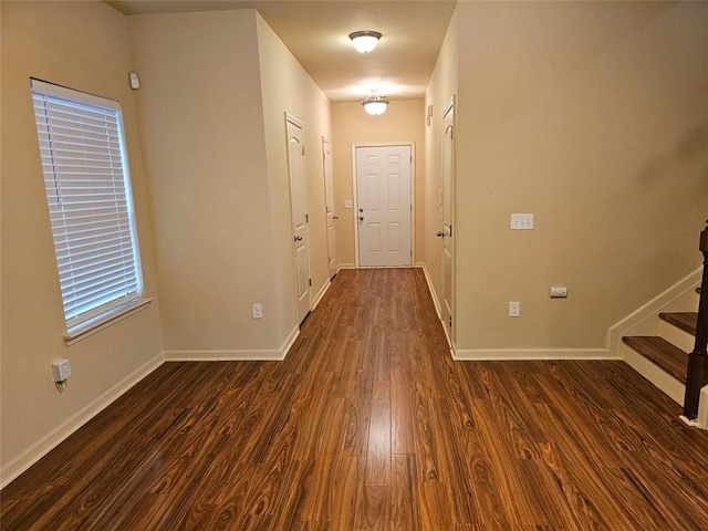 corridor featuring dark hardwood / wood-style floors