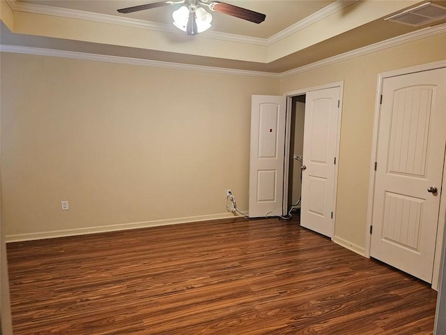 unfurnished bedroom featuring ceiling fan, ornamental molding, and dark wood-type flooring