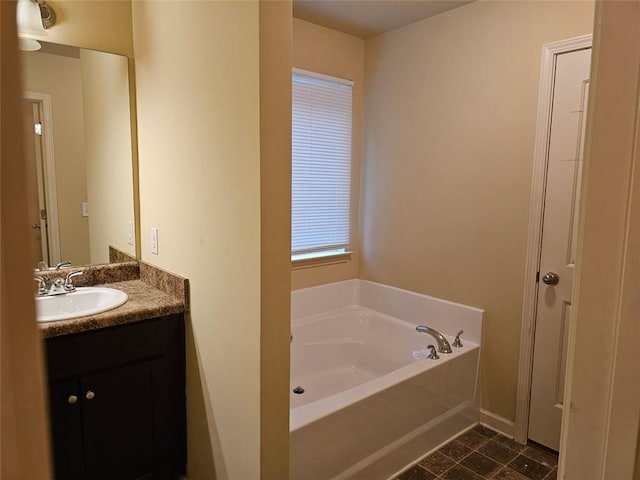 bathroom featuring vanity and a bathing tub