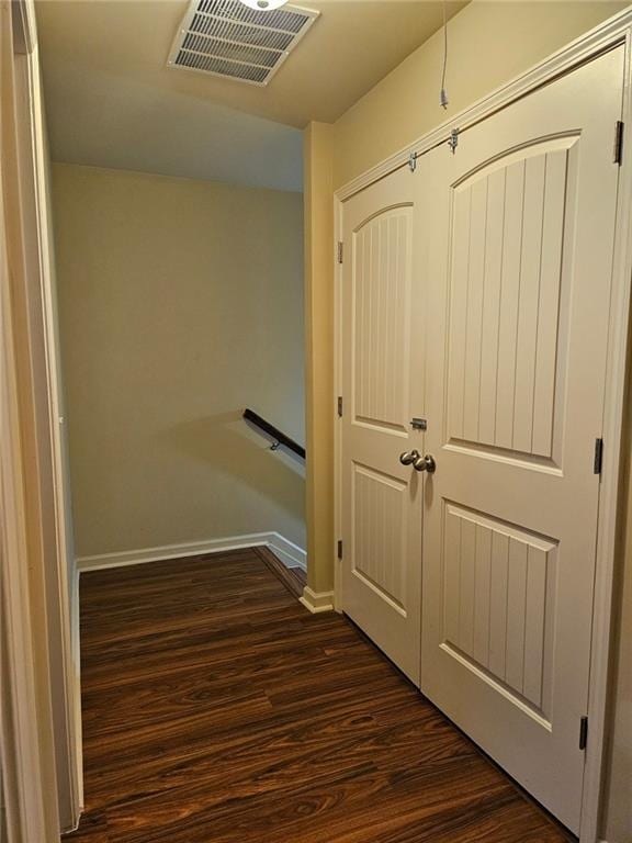 hallway featuring dark wood-type flooring