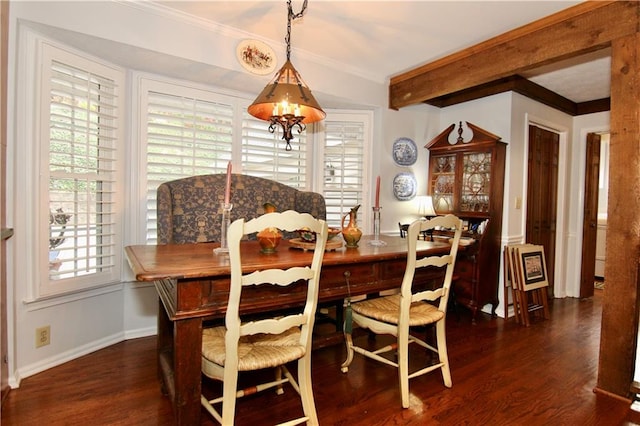 dining room featuring beam ceiling, wood finished floors, baseboards, and ornamental molding