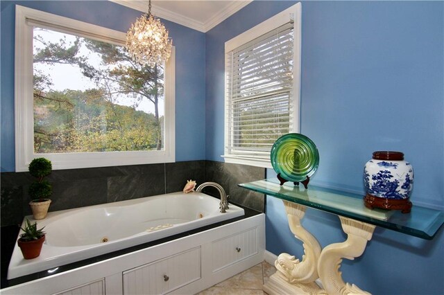 bathroom with tile patterned floors, ornamental molding, and a whirlpool tub