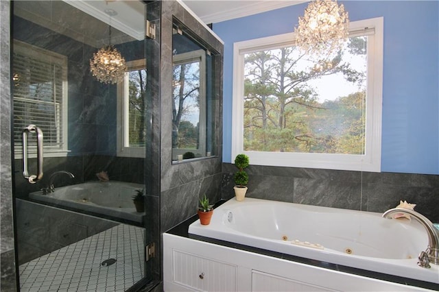 full bath with a jetted tub, crown molding, and an inviting chandelier