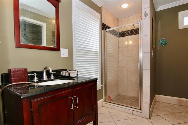 full bath featuring tile patterned flooring, a shower stall, baseboards, and ornamental molding