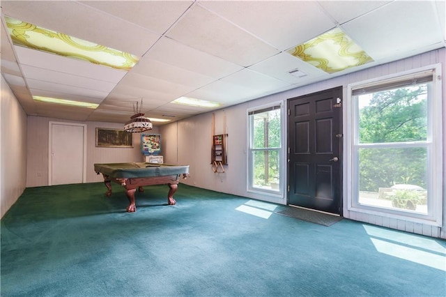 playroom featuring a drop ceiling, a healthy amount of sunlight, and carpet flooring