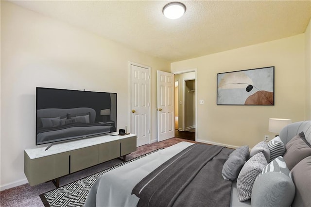 6445 Marsham Dr, Atlanta, GA 30349 - bedroom with carpet flooring, baseboards, and a textured ceiling