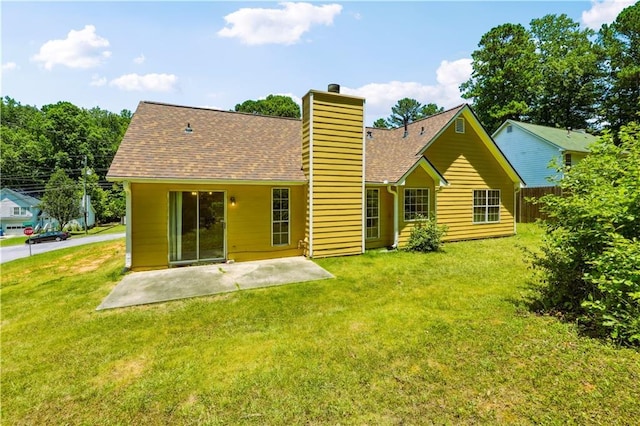 6445 Marsham Dr, Atlanta, GA 30349 - back of house with a chimney, a patio, and a shingled roof