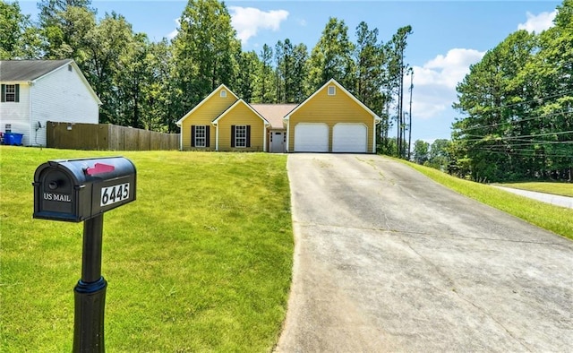 6445 Marsham Dr, Atlanta, GA 30349 - view of front of house with concrete driveway and an attached garage
