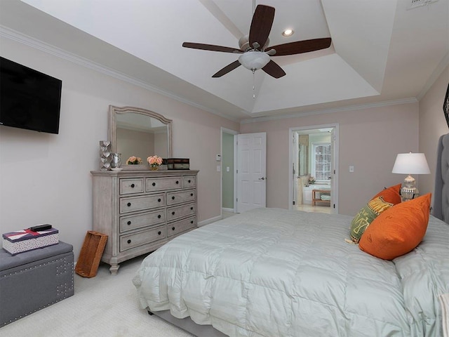 carpeted bedroom with a tray ceiling, ornamental molding, and ceiling fan