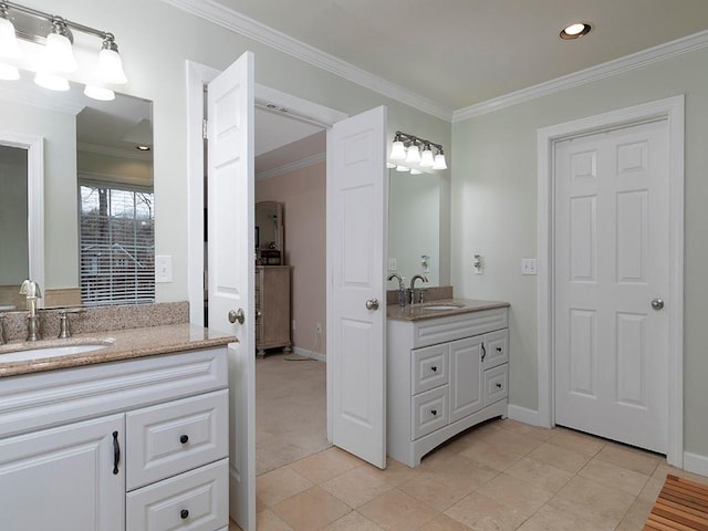 bathroom featuring ornamental molding, tile patterned flooring, and vanity